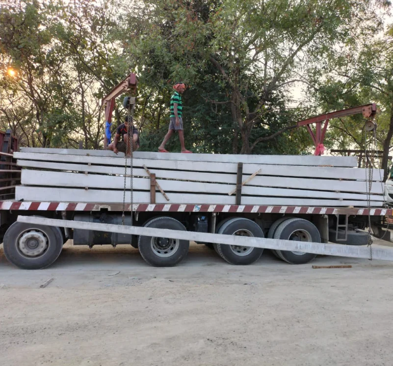 Own fleet — flatbed loaded with finished PSCC poles